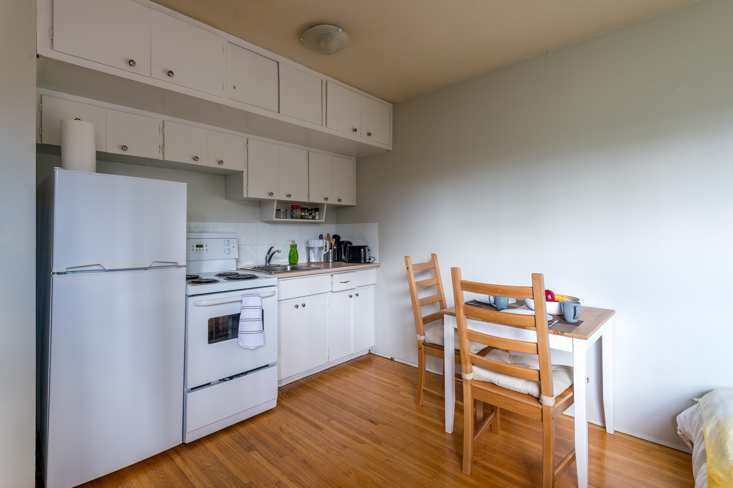 Cozy kitchen with a small dinner table. Interior design. Cozy kitchen with a small dinner table. Interior design.
